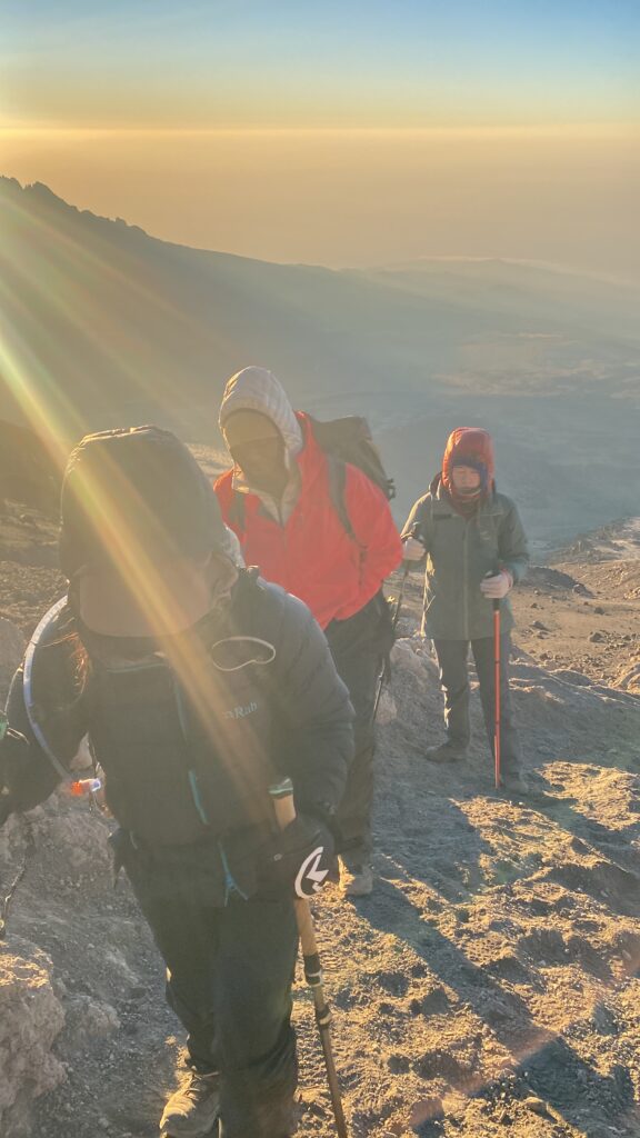 Climbers reaching Uhuru Peak Mount Kilimanjaro