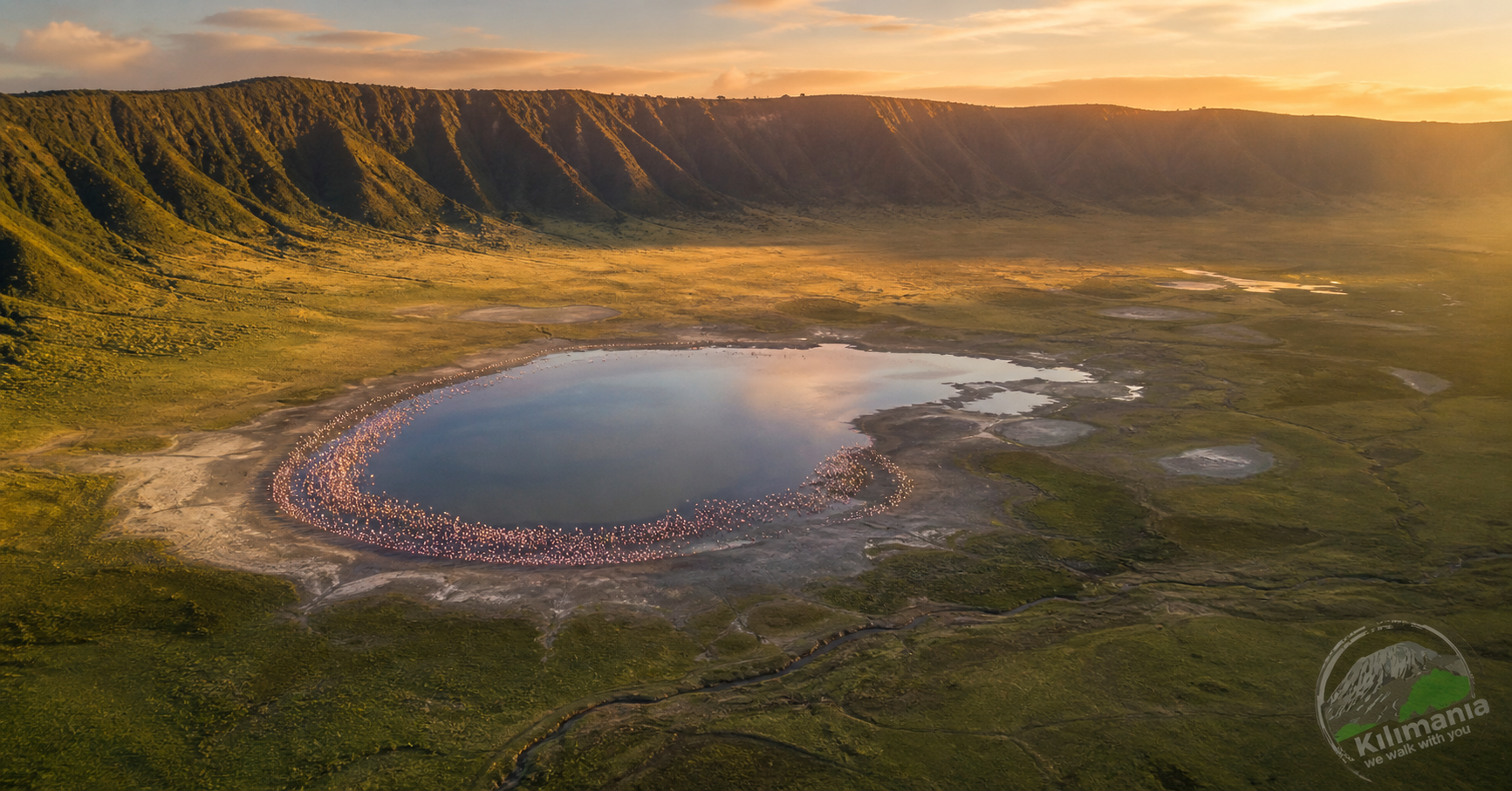 Ngorongoro Crater fees 2026 aerial view Lake Magadi flamingos crater floor Tanzania golden hour