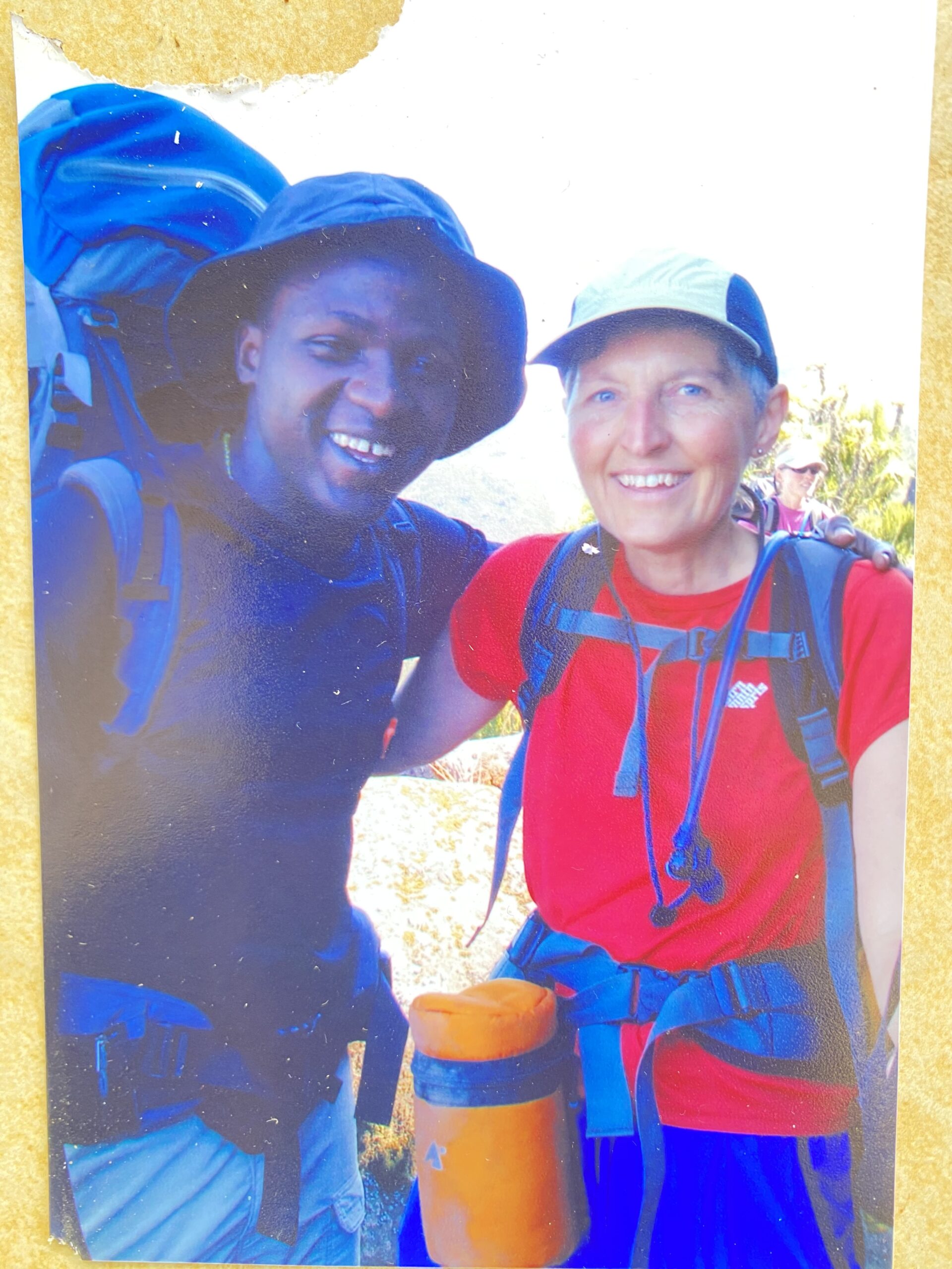Sabinus Msimba with the expedition team leader from the United States, Mount Kilimanjaro, during a summit expedition 21 years ago, Senior Kilimanjaro Guide