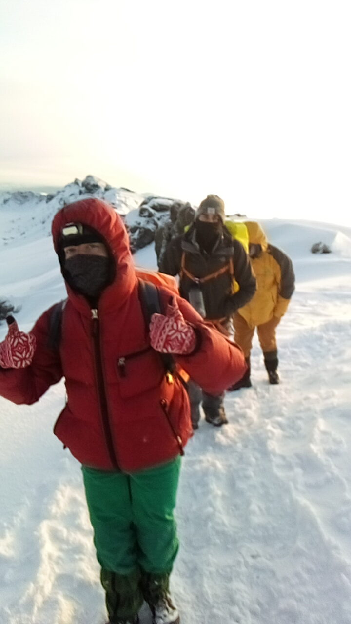 Climbers ascending Kilimanjaro during summit night above 5,000 metres in extreme cold and low oxygen conditions