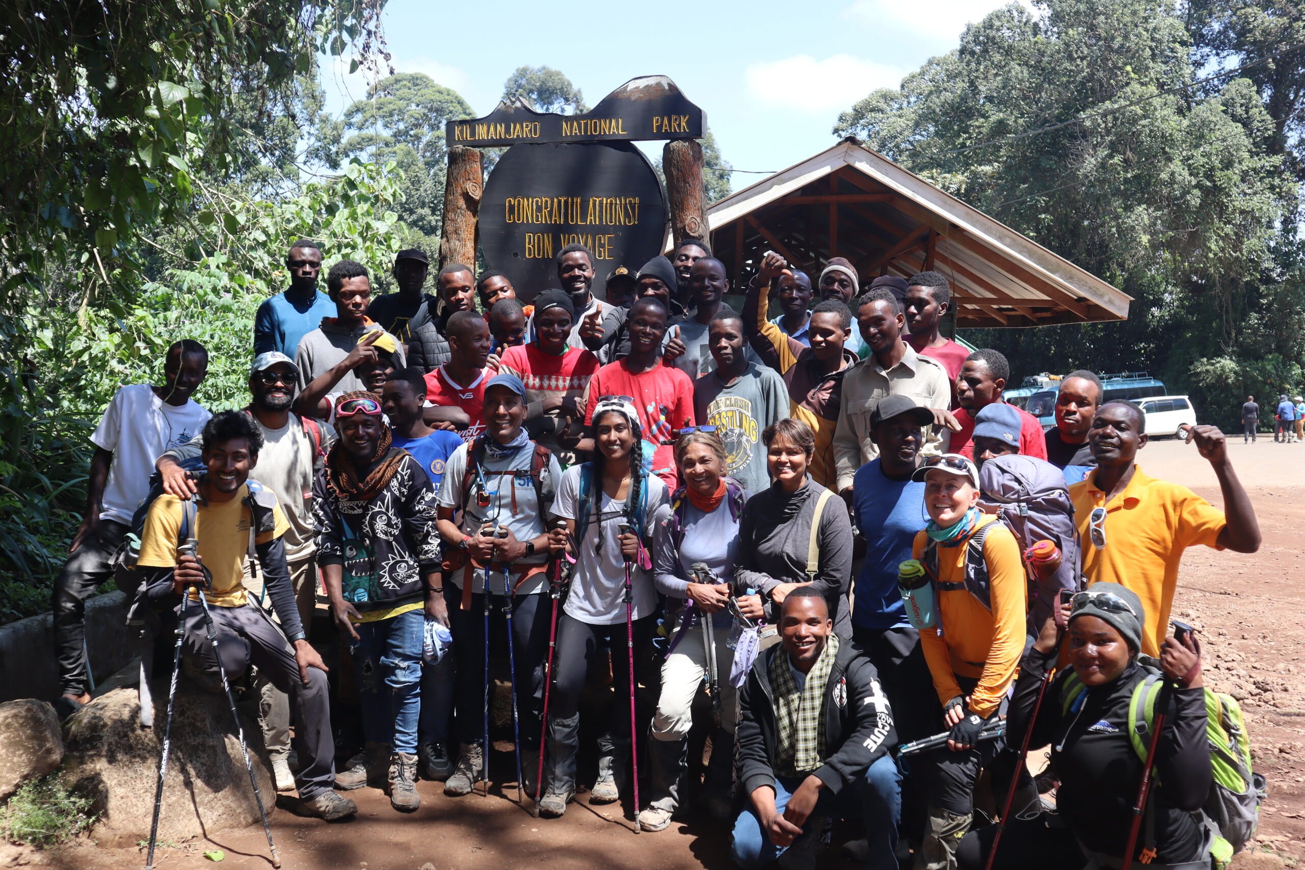Kilimania Adventure climbers, porters, and guides gathered at Mweka Gate, Kilimanjaro National Park