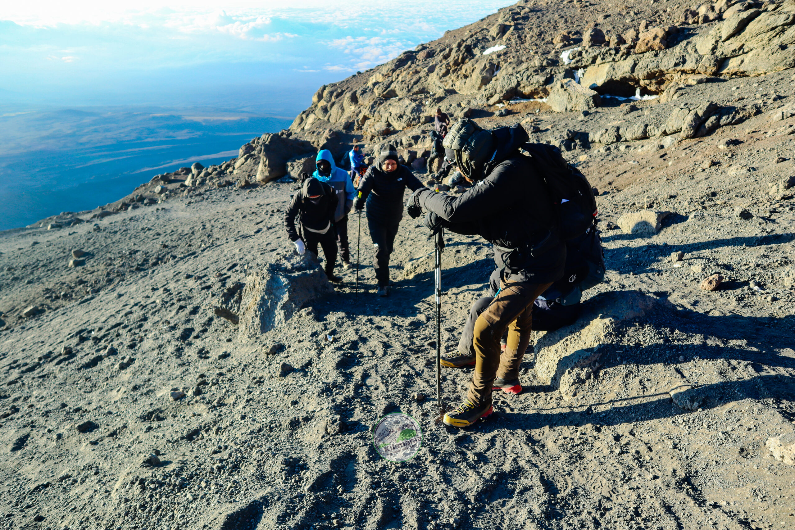 Kilimanjaro vs Everest Base Camp — Kilimania guide Sabinus Msimba leading summit push above Barafu Camp Kilimanjaro 2026