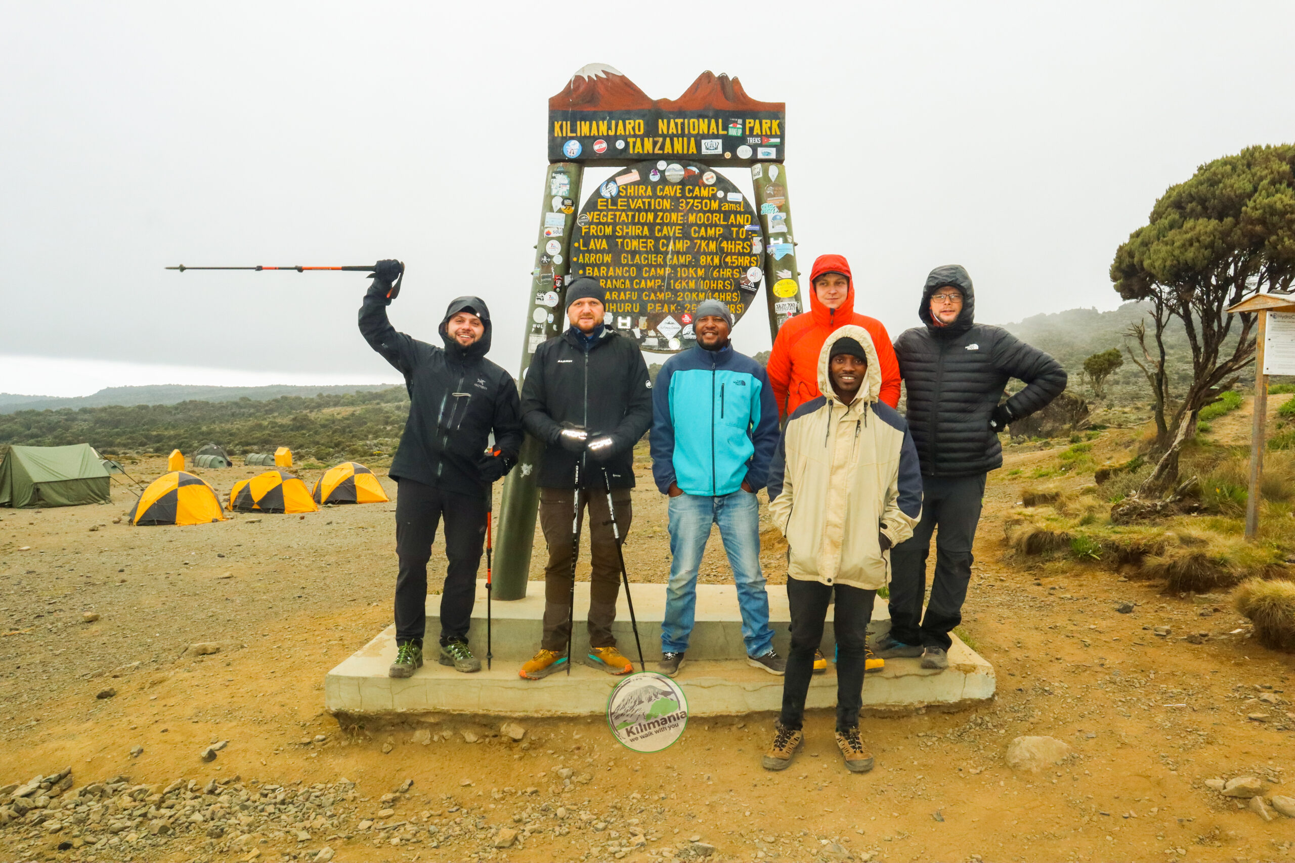 Chief Guide Isack Mlala and Assistant Guide Diaz Charles lead Kilimania climbers on an acclimatisation hike from Shira Camp toward Shira Cave at approximately 4,000 m on the Machame Route, Kilimanjaro National Park, Tanzania 2026