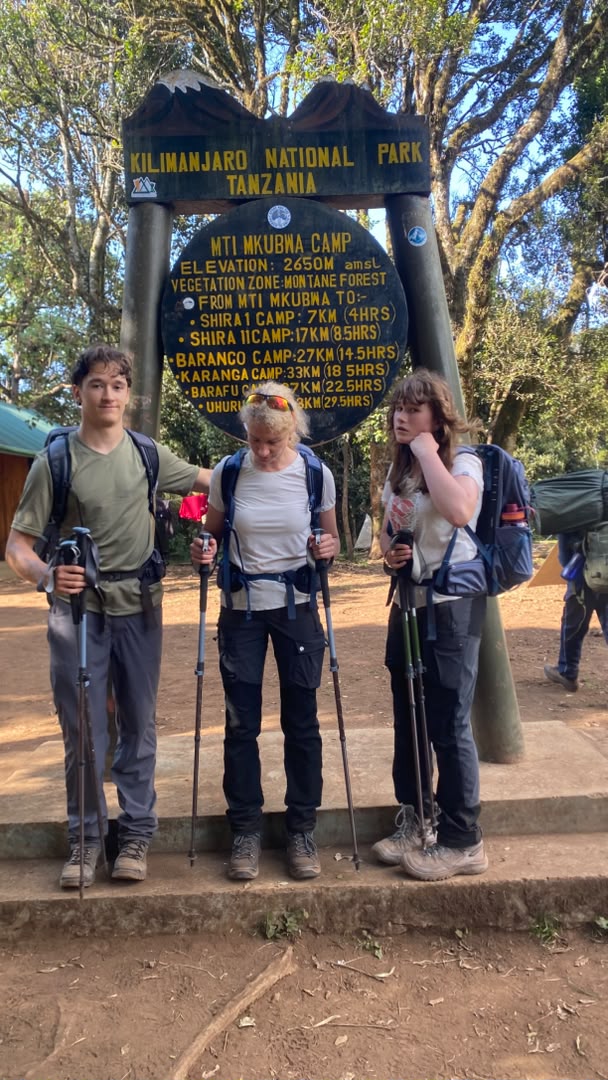 A mother with her son and daughter at Mti Mkubwa Camp, 2,650m, on Day 1 of the 8-day Lemosho Route Climbing Kilimanjaro as a Family