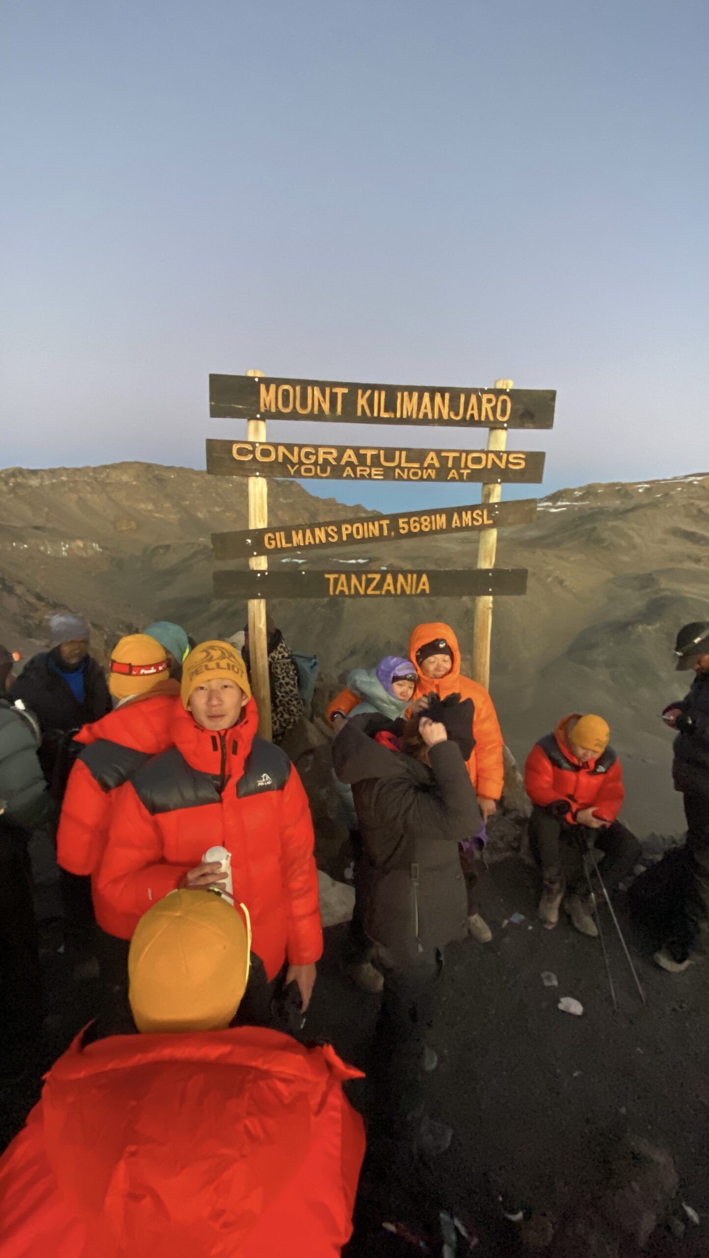 Senior Kilimanjaro guide checking a climber's altitude response at Horombo Hut during the Zebra Rock acclimatization day on the 6-day Marangu Route