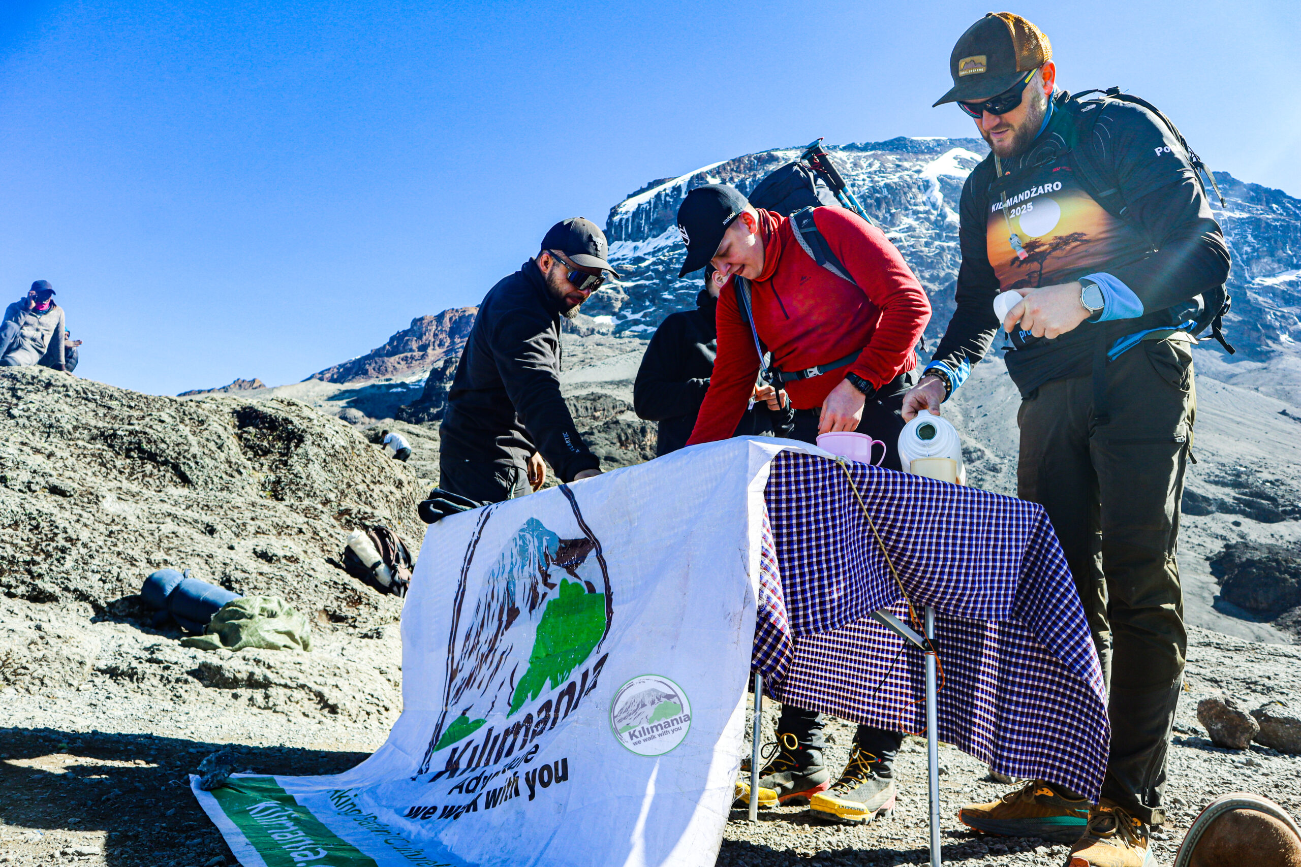 Kilimania Adventure crew serving a hot breakfast in the alpine zone below Kilimanjaro's glaciers