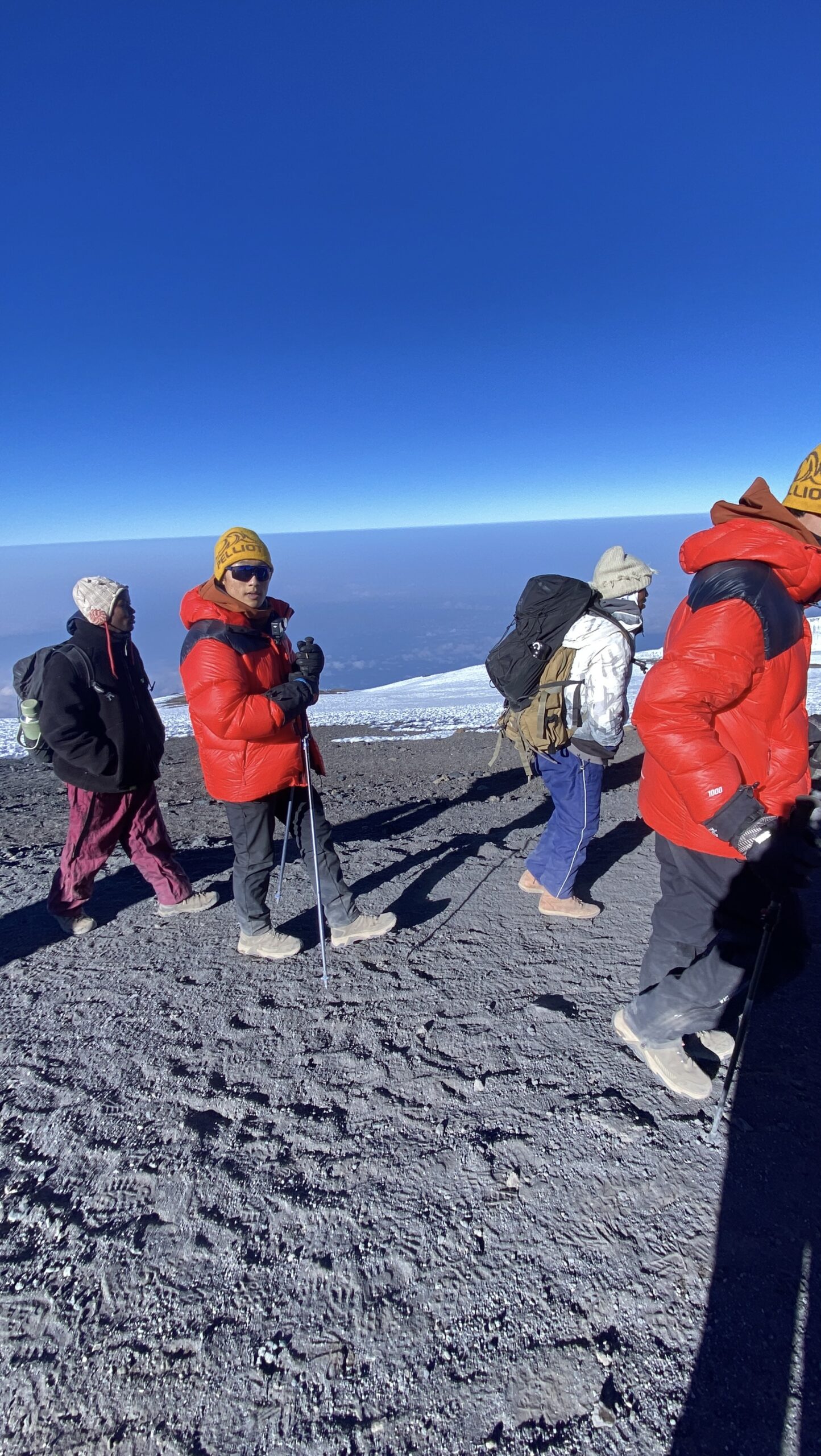 Sabinus Msimba guiding a high-altitude section of Kilimanjaro above the cloud line