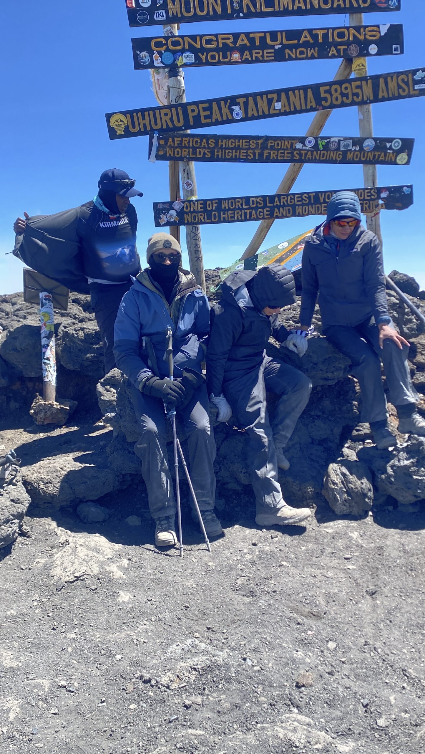 The Kilimania Adventure team celebrating at Uhuru Peak, 5,895m, the summit of Mount Kilimanjaro
