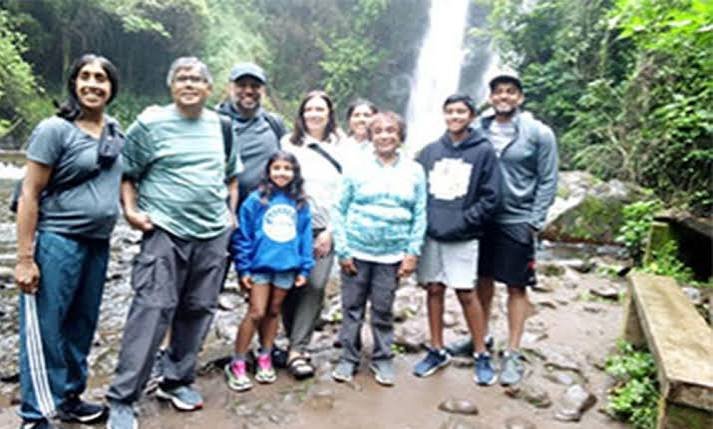 Family group resting at Ndoro Waterfalls on the Marangu Waterfalls day trip