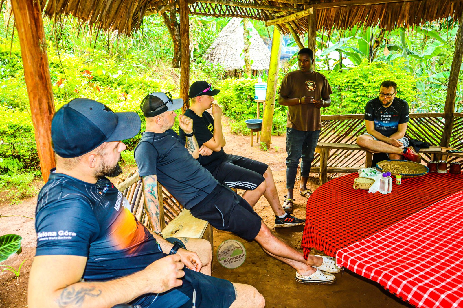 Chagga coffee and banana wine demonstration at Materuni village during a Kilimania day trip