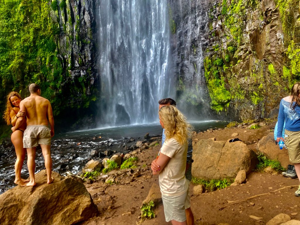 Kilimania clients at the base pool of Materuni Waterfalls, Moshi, Tanzania