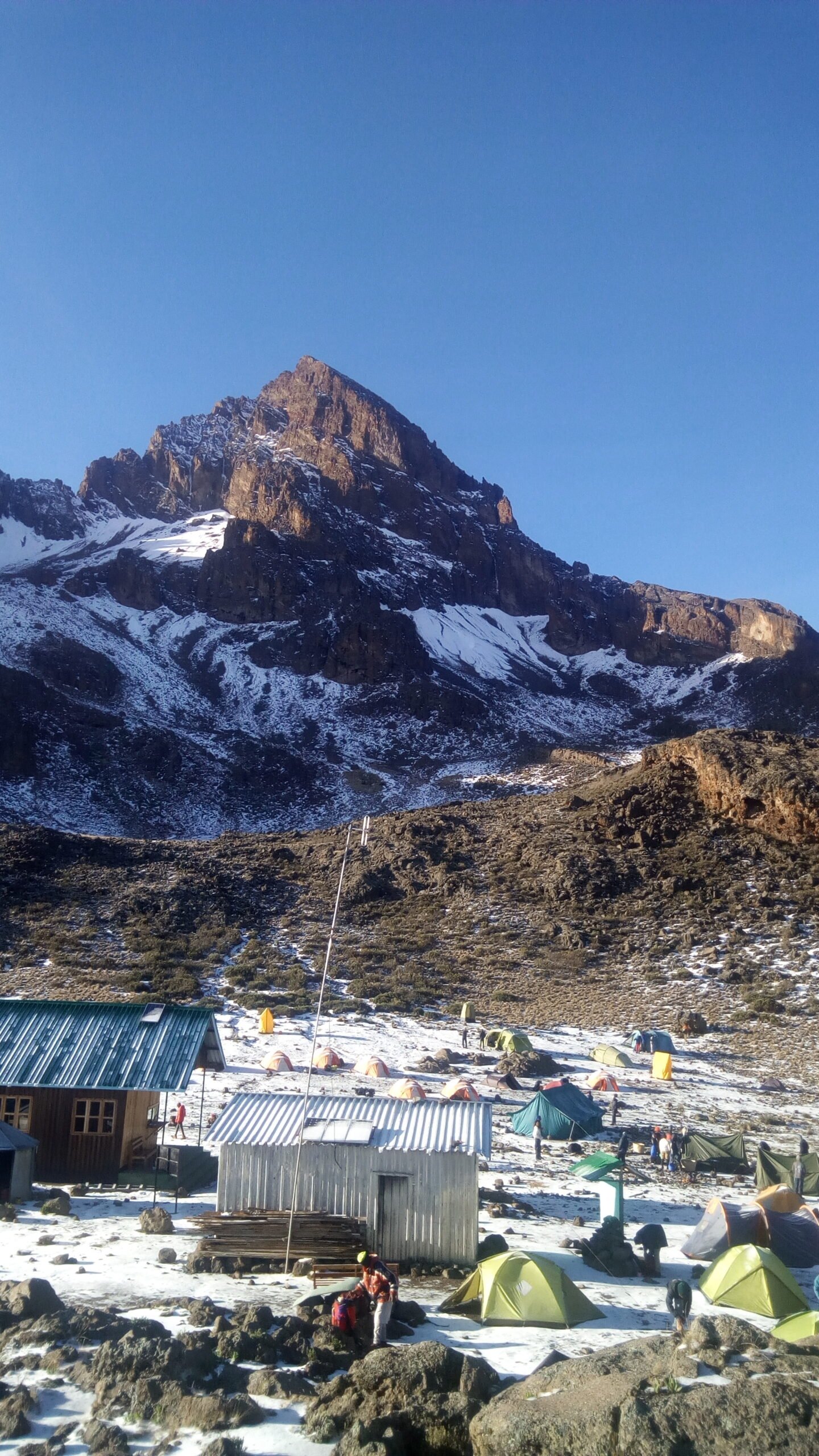 Snow-dusted high-altitude scenery on Kilimanjaro's northern approach toward Kibo