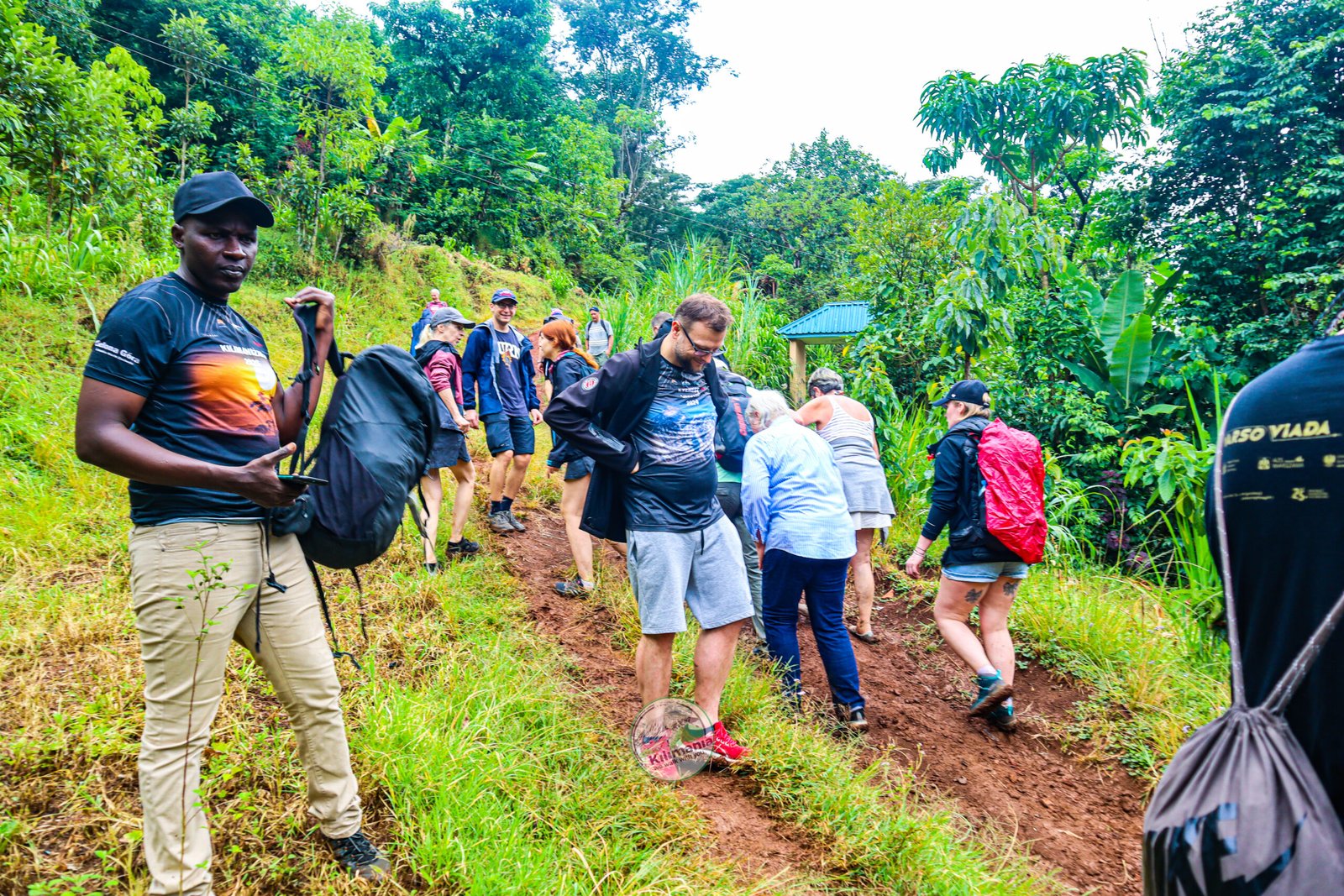 Sabinus Msimba leading a group along the Materuni Waterfalls trail near Moshi